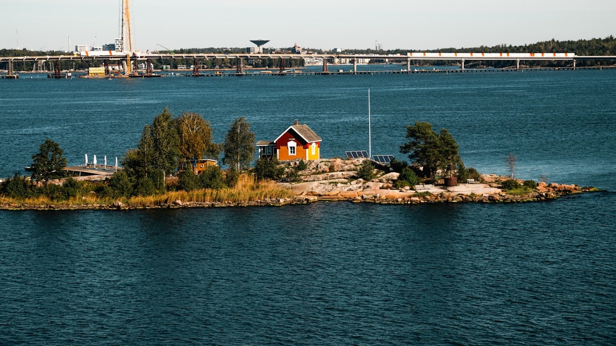 A small island in the middle of a large body of water